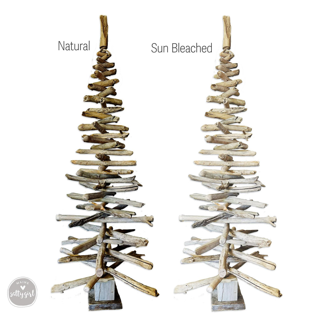 a tree made out of driftwood is shown next to another tree made out of