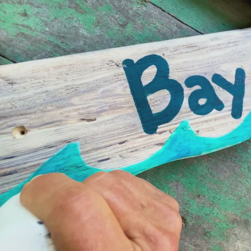 Signs on a Post with Hand Painted Graphics