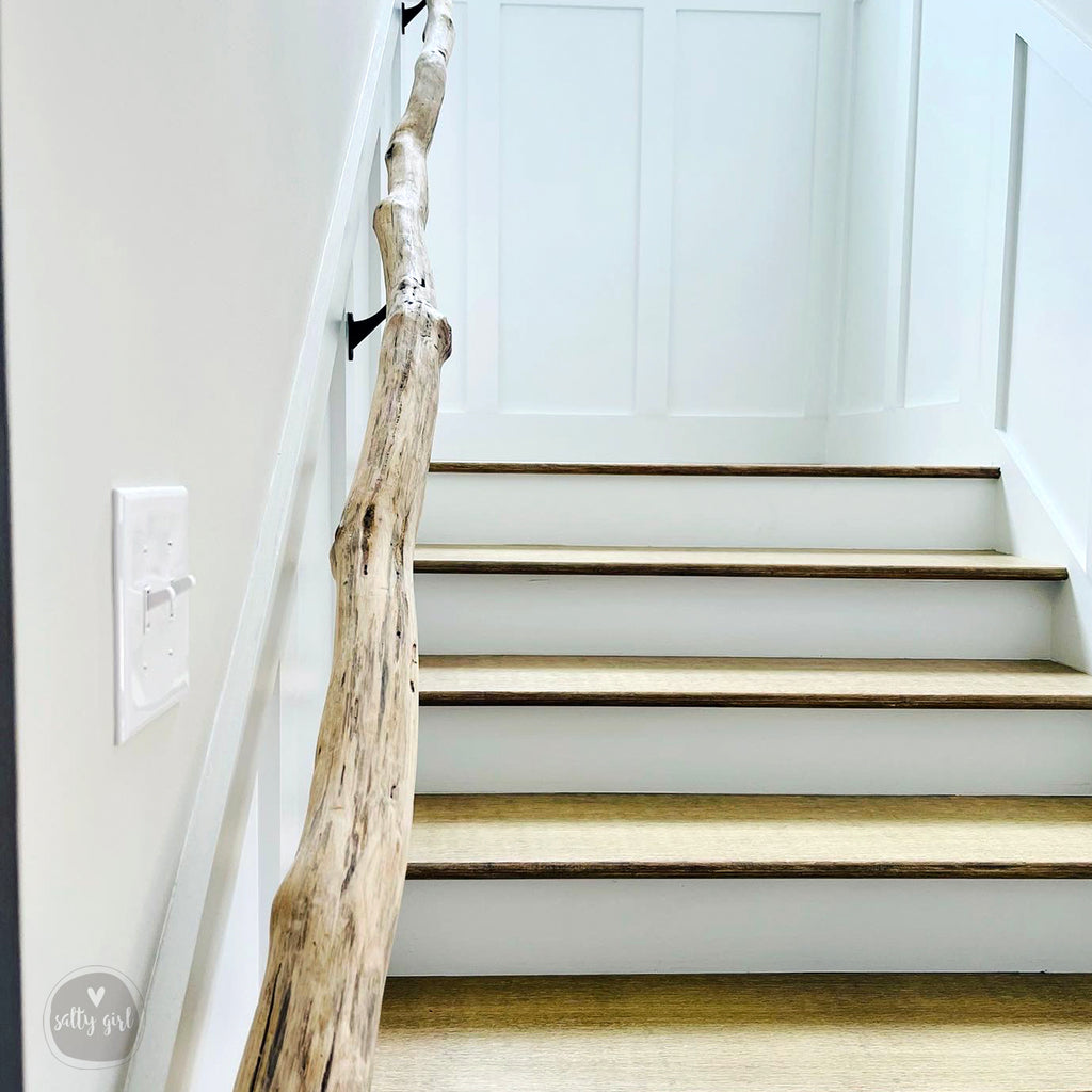 Driftwood handrail installed on staircase