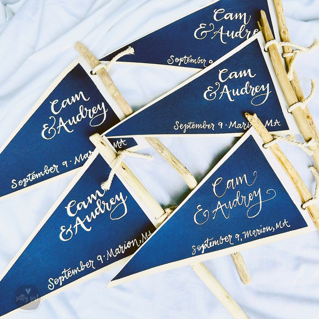 blue and white flag table markers on white fabric