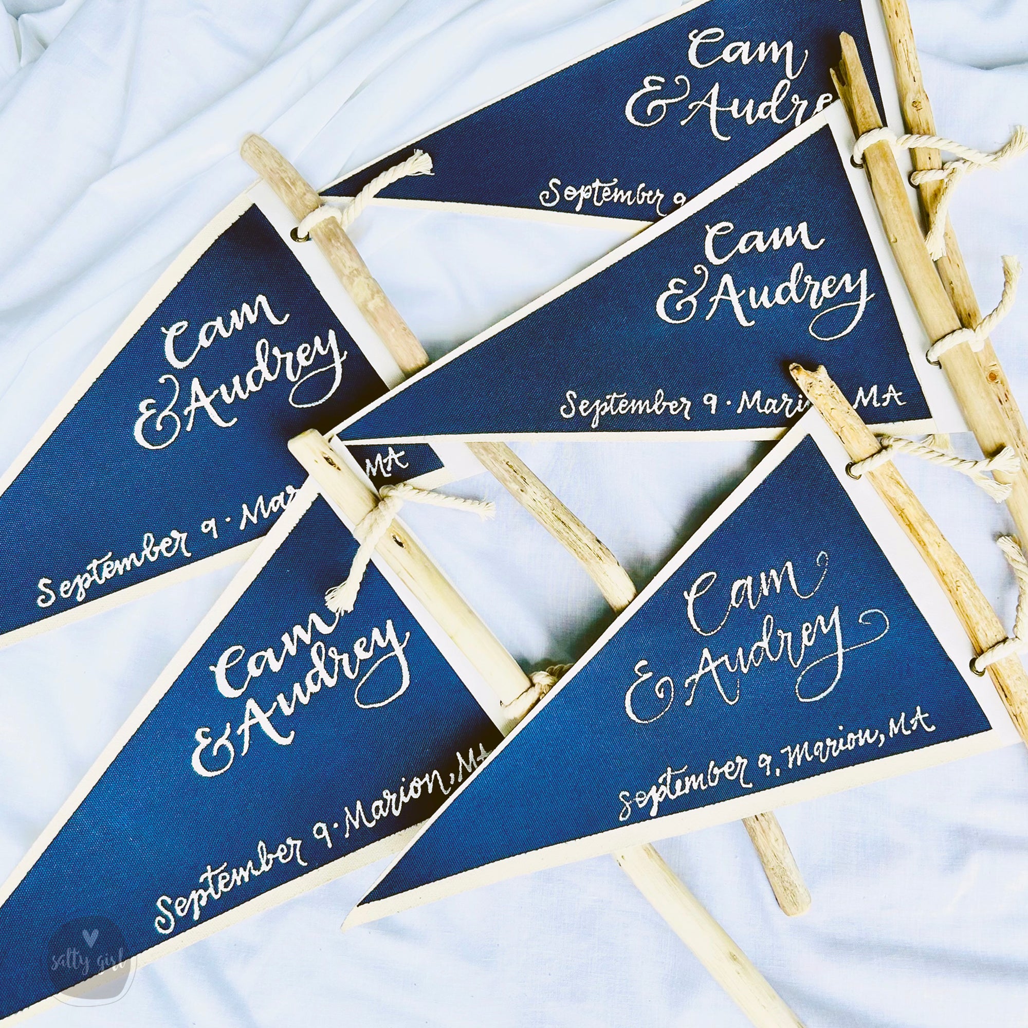 blue and white flag table markers on white fabric