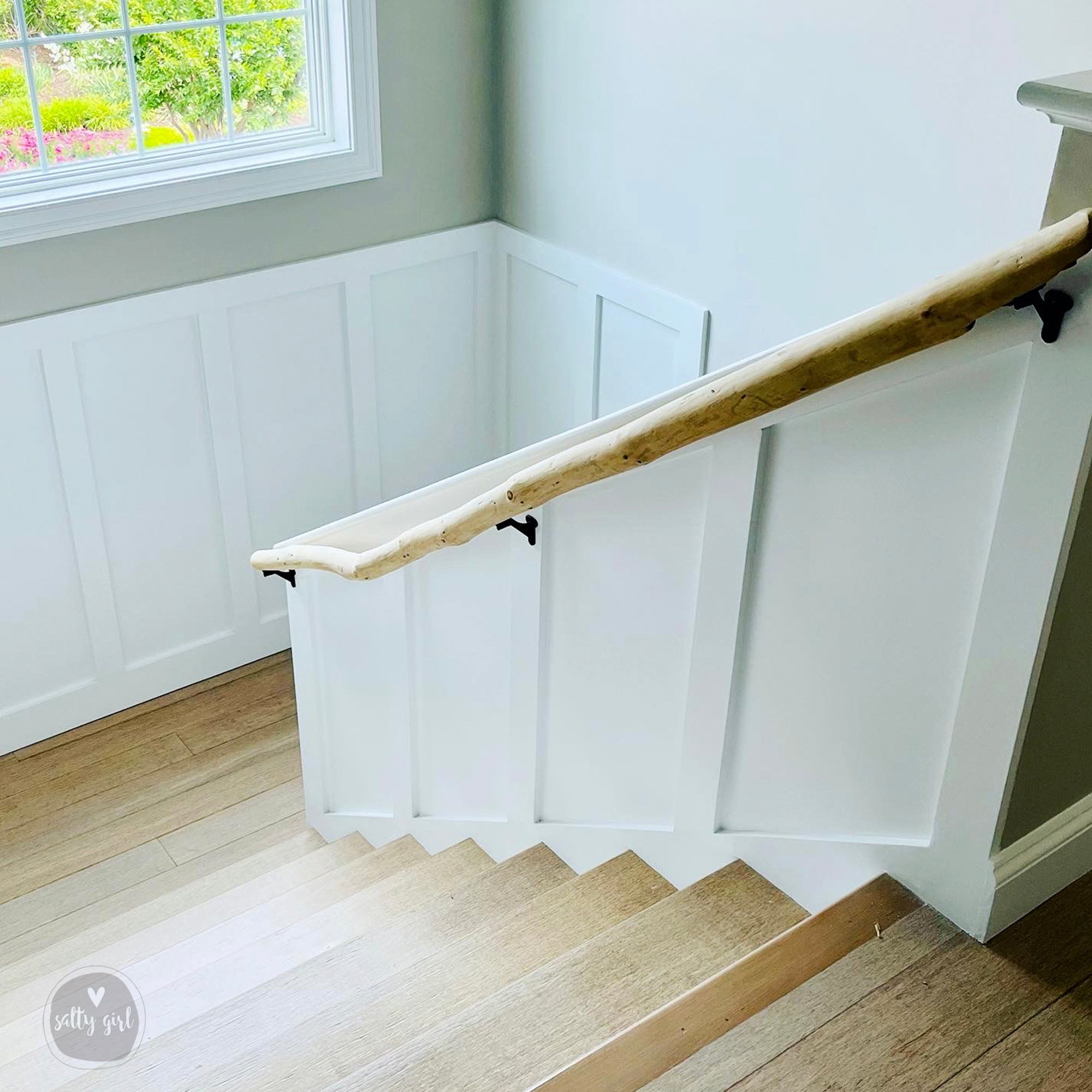 Driftwood handrail installed on staircase