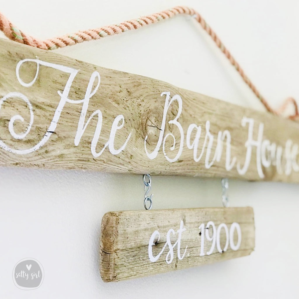 Double hanging sign with light orange fishing rope