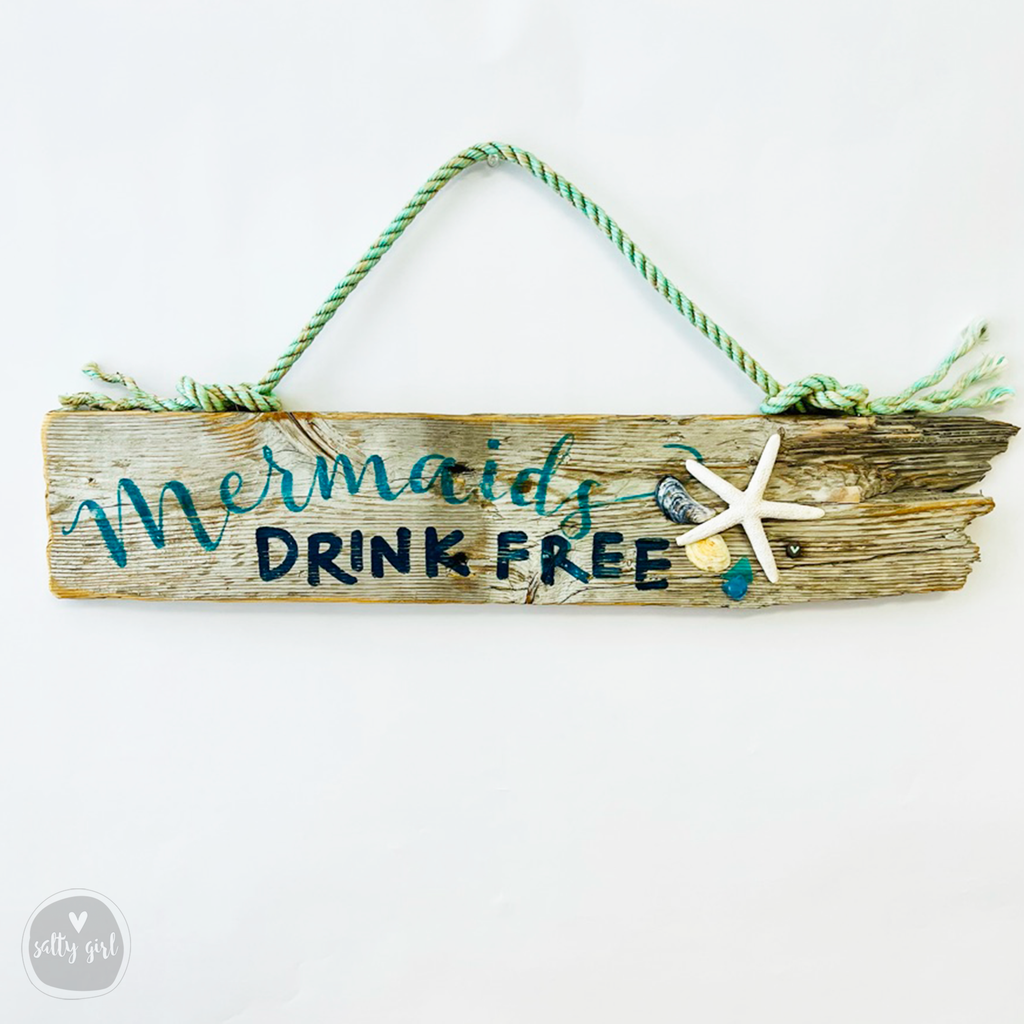 Driftwood "Mermaids Drink Free" Sign - Wooden Mermaid Sign with Fishing Rope Hanger and Starfish - Beachie Wall Decor