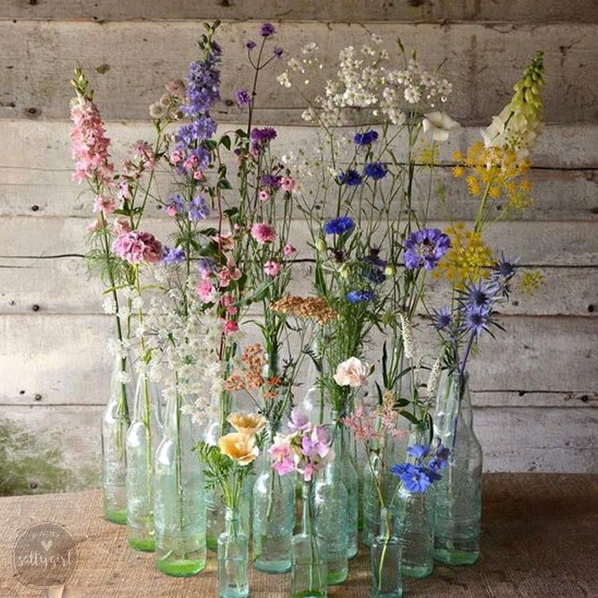 a bunch of vases that have flowers in them