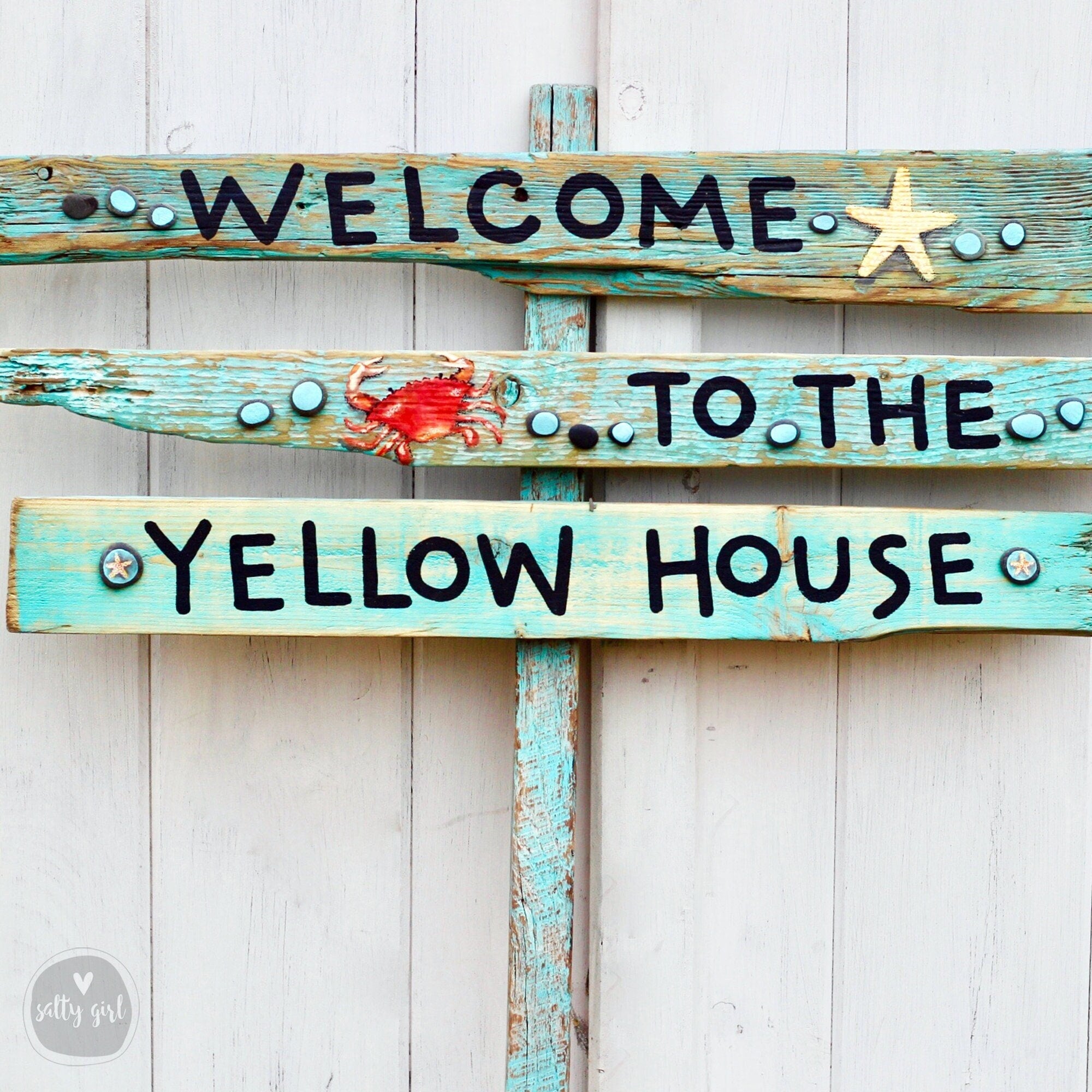 Signs on a Post with Hand Painted Graphics